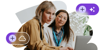 Two female employees working on an AI-assisted project