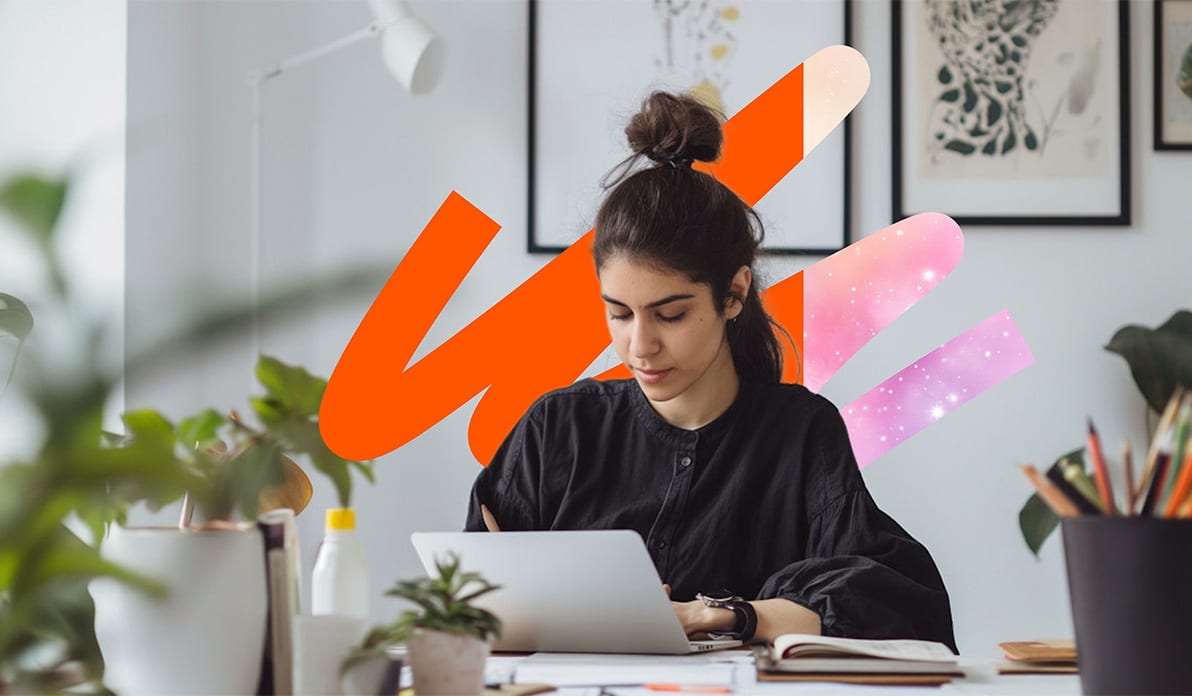 Woman sitting at her desk reviewing papers