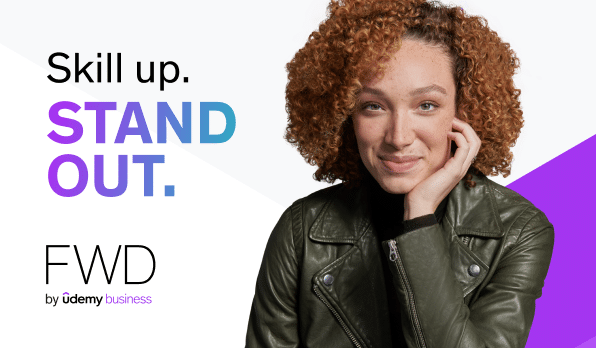 Woman with curly hair and a leather jacket looking confidently at you